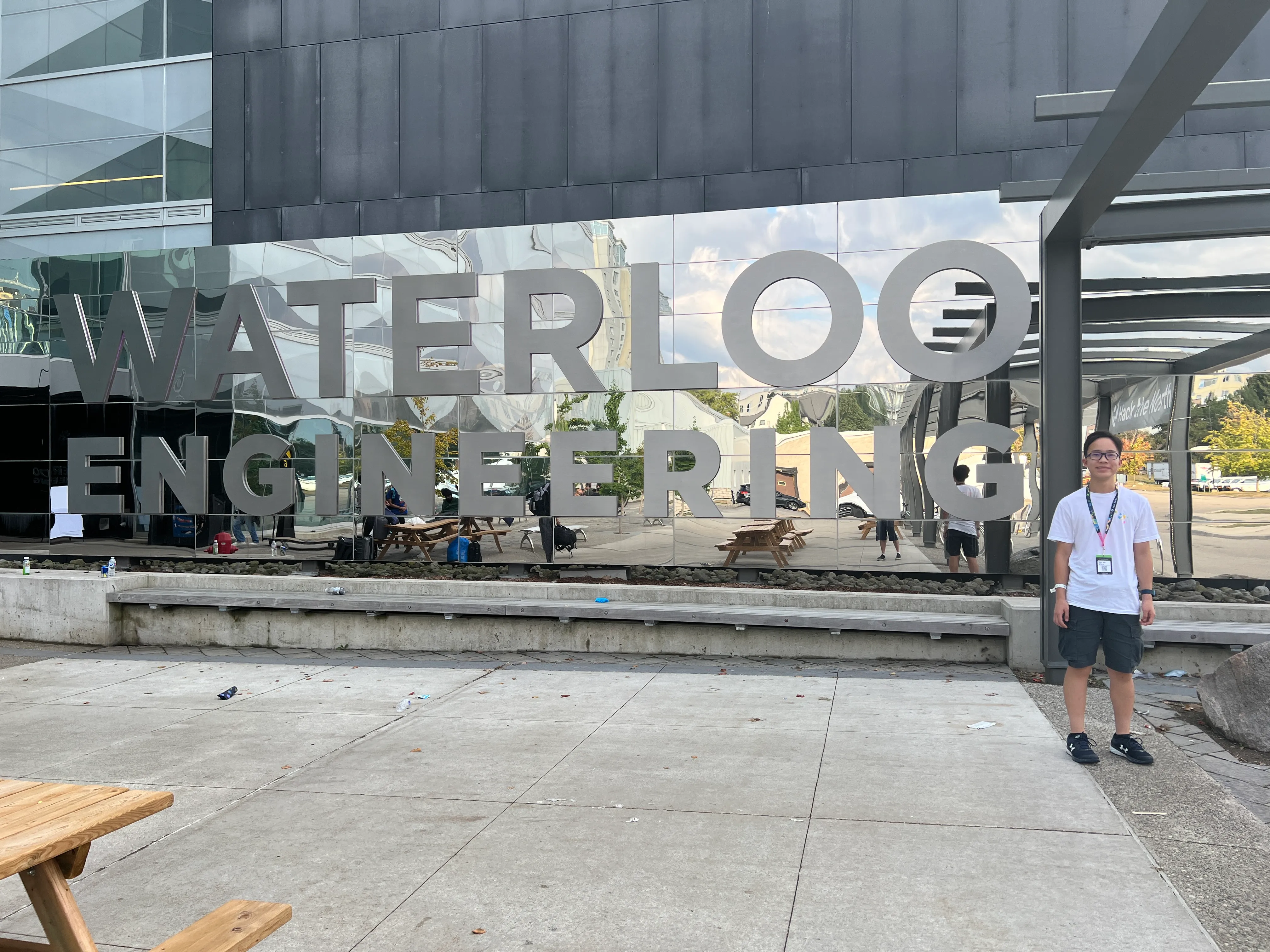 Me in front of a Waterloo Engineering sign